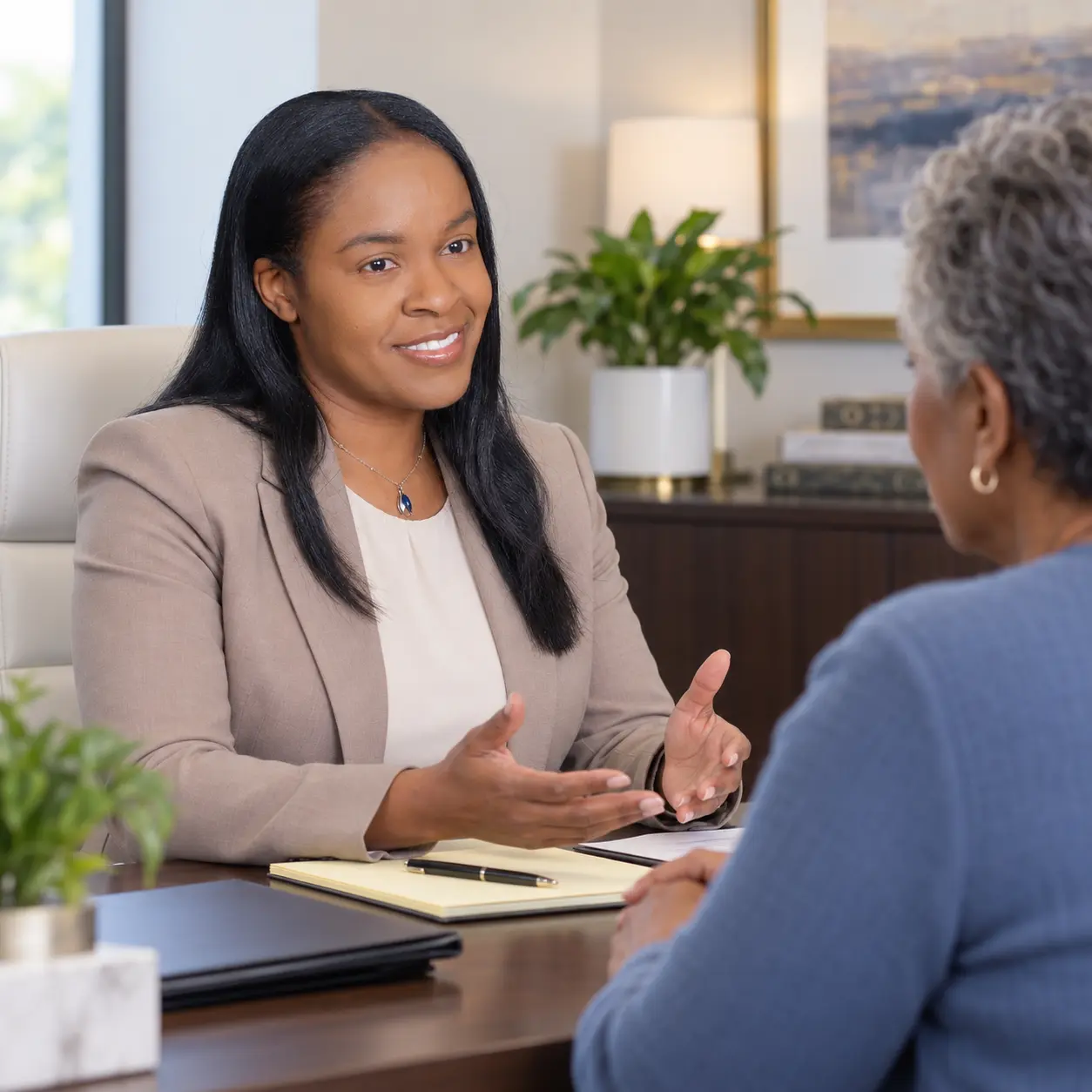 Lauren R. Henry reviewing a personal injury matter with a client.